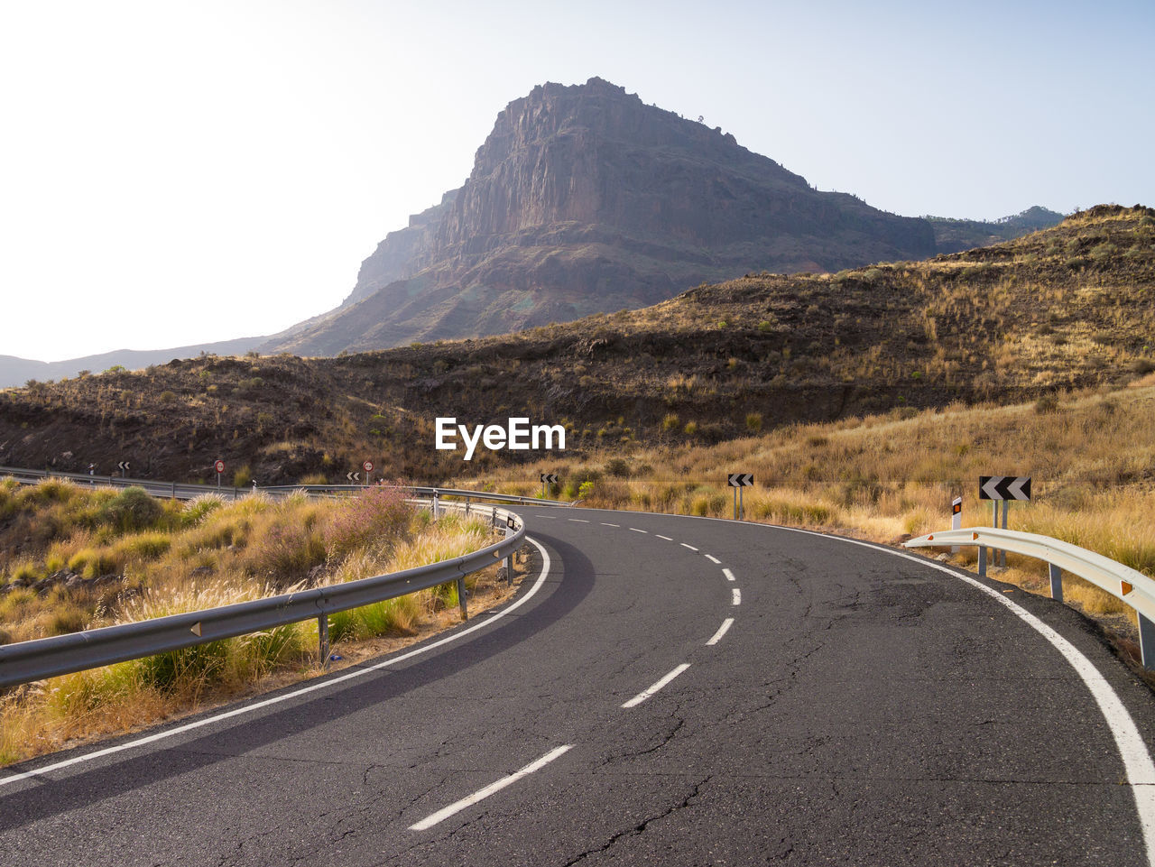 ROAD PASSING THROUGH MOUNTAINS