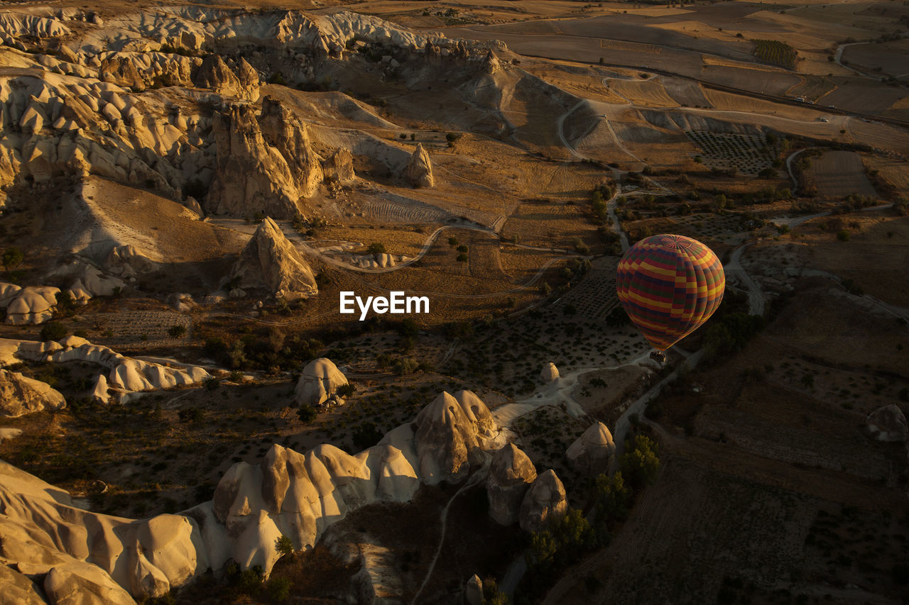 Aerial view of hot air balloon against landscape