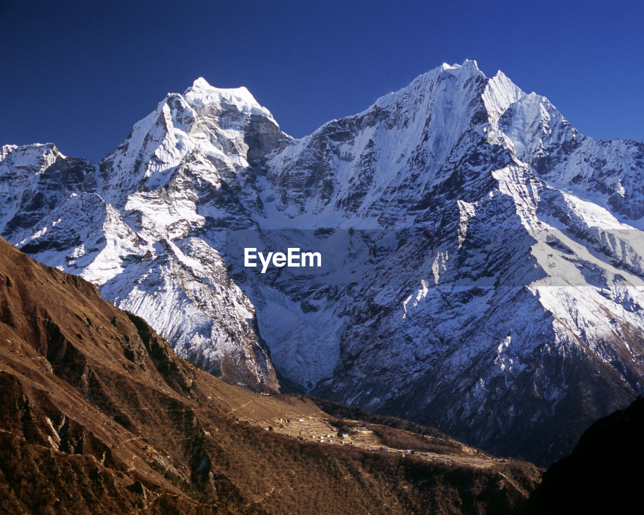 SNOWCAPPED MOUNTAINS AGAINST CLEAR SKY