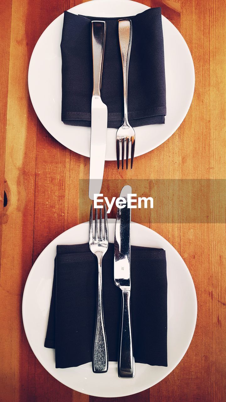 Directly above shot of plates arranged on table