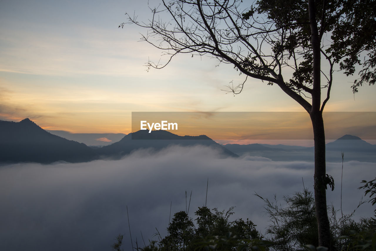 SCENIC VIEW OF MOUNTAINS AGAINST SKY DURING SUNSET