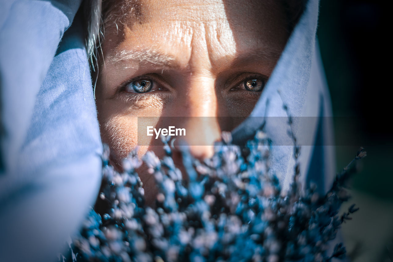 Close-up portrait of woman wearing scarf