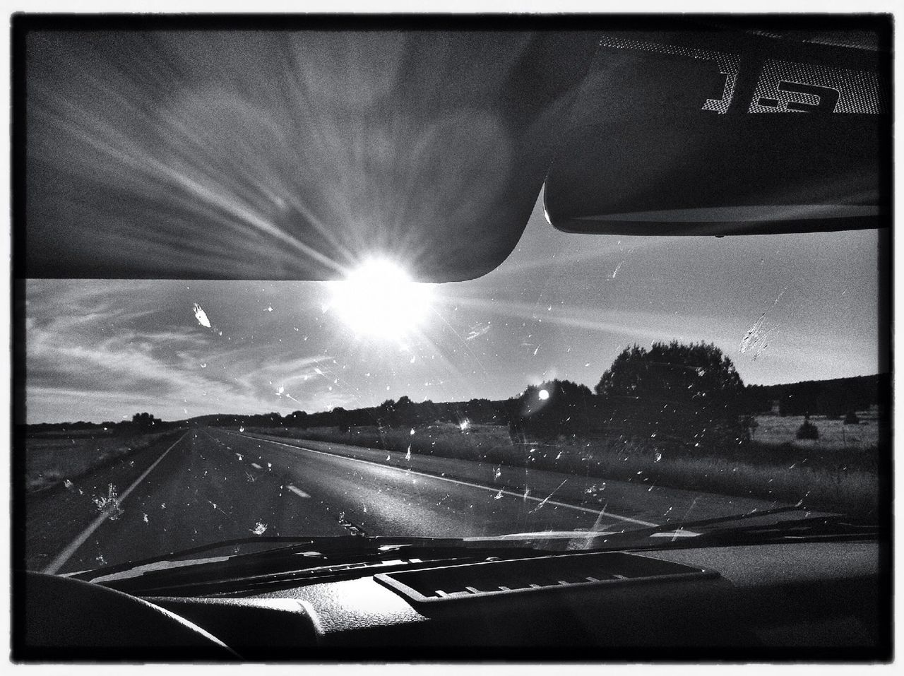 Sun seen through car windshield