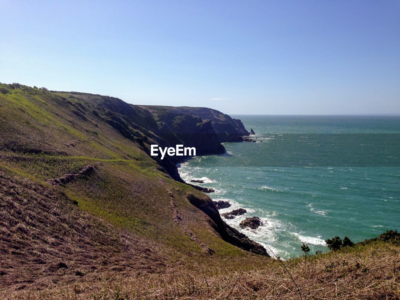 Scenic view of sea against clear sky