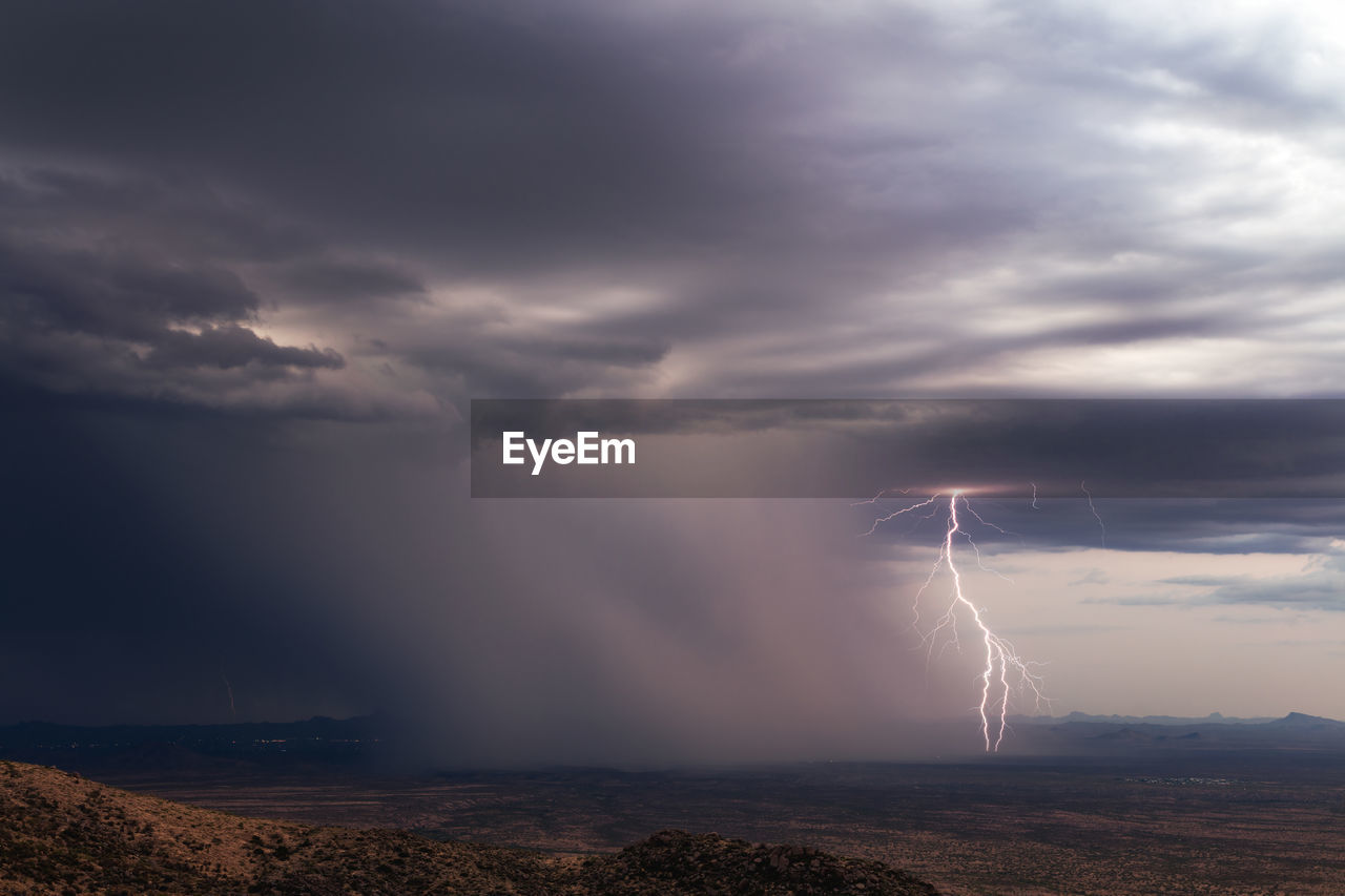 A lightning bolt strikes from a monsoon thunderstorm near yarnell, arizona.