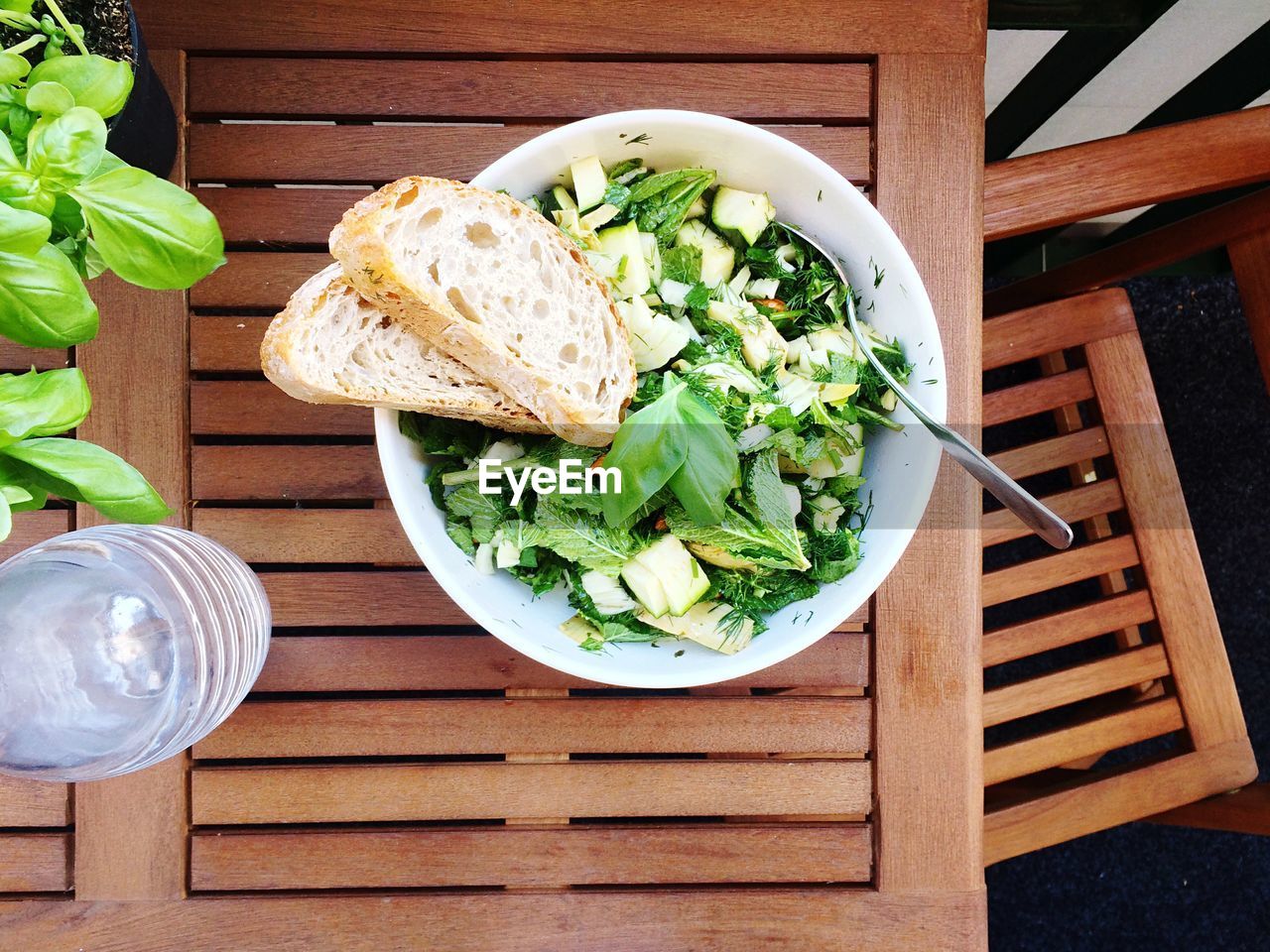 Directly above shot of salad with bread on table