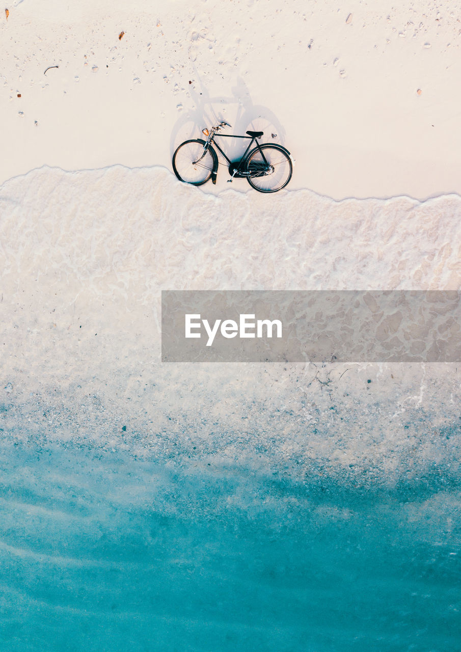 High angle view of bicycle by sea