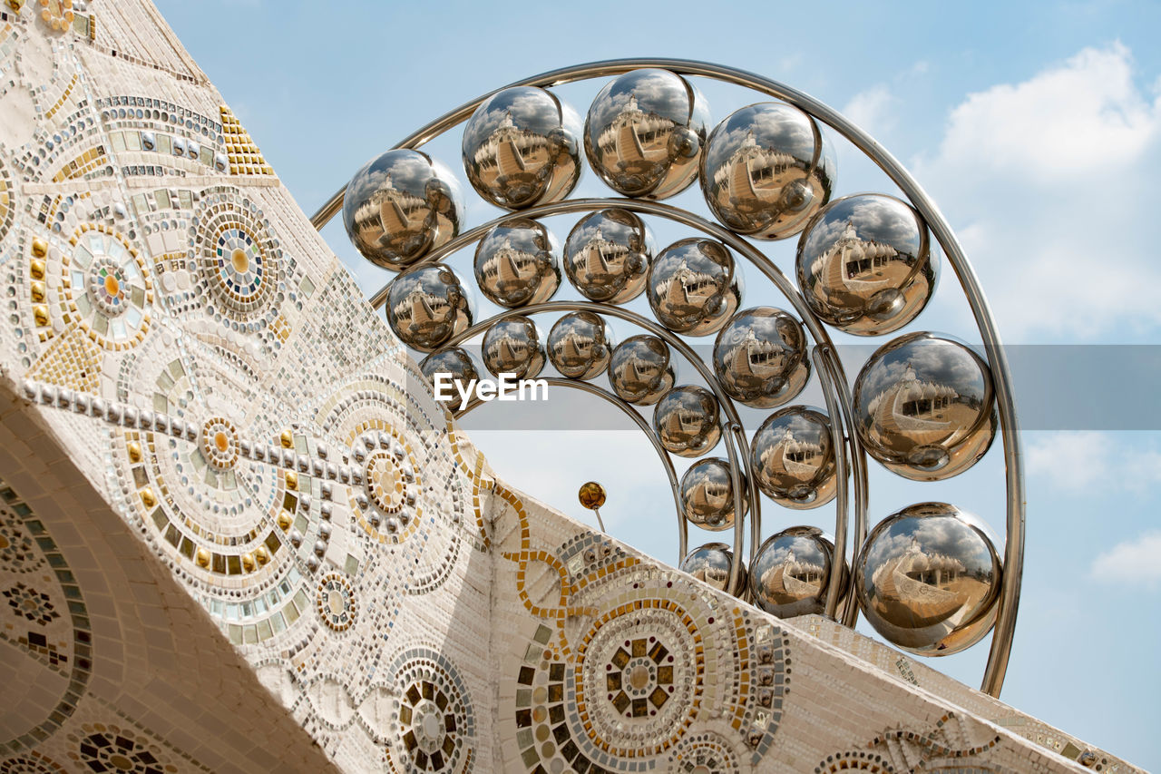 Low angle view of ornate building against sky