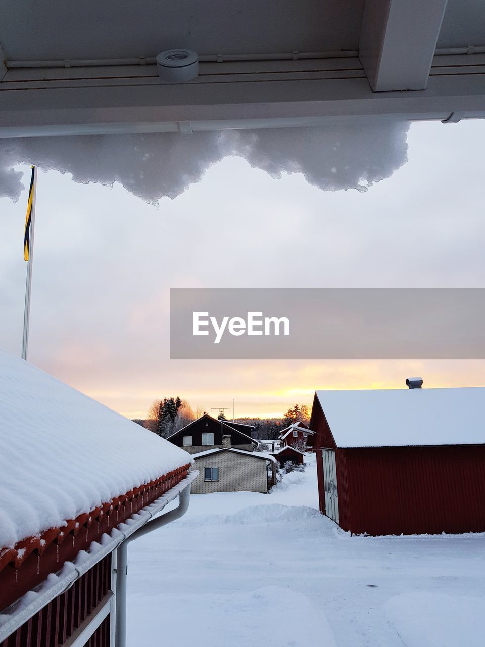 Houses against sky during winter