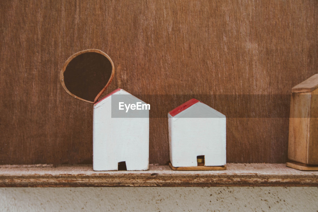 Model houses on shelf