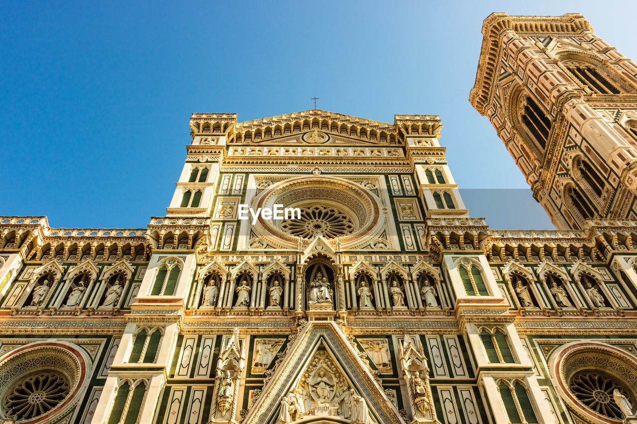 Low angle view of duomo santa maria del fiore against clear sky in city