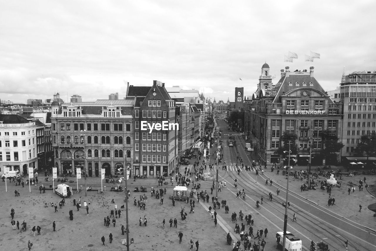 High angle view of people walking in front of buildings