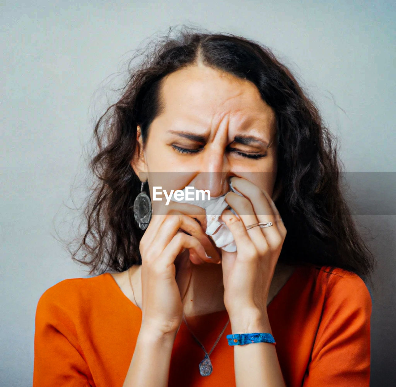 women, adult, teenager, human face, one person, portrait, person, nose, close-up, studio shot, young adult, emotion, indoors, human mouth, sadness, female, headshot, depression - sadness, eyes closed, emotional stress, front view, cold and flu, finger, hand, skin, flu virus, lip, hands covering mouth, brown hair, illness, despair, medical, negative emotion, head in hands, lifestyles, human eye, singing, worried, photo shoot, human head, frustration, pain, hairstyle, copy space, headache, long hair, contemplation, facial expression