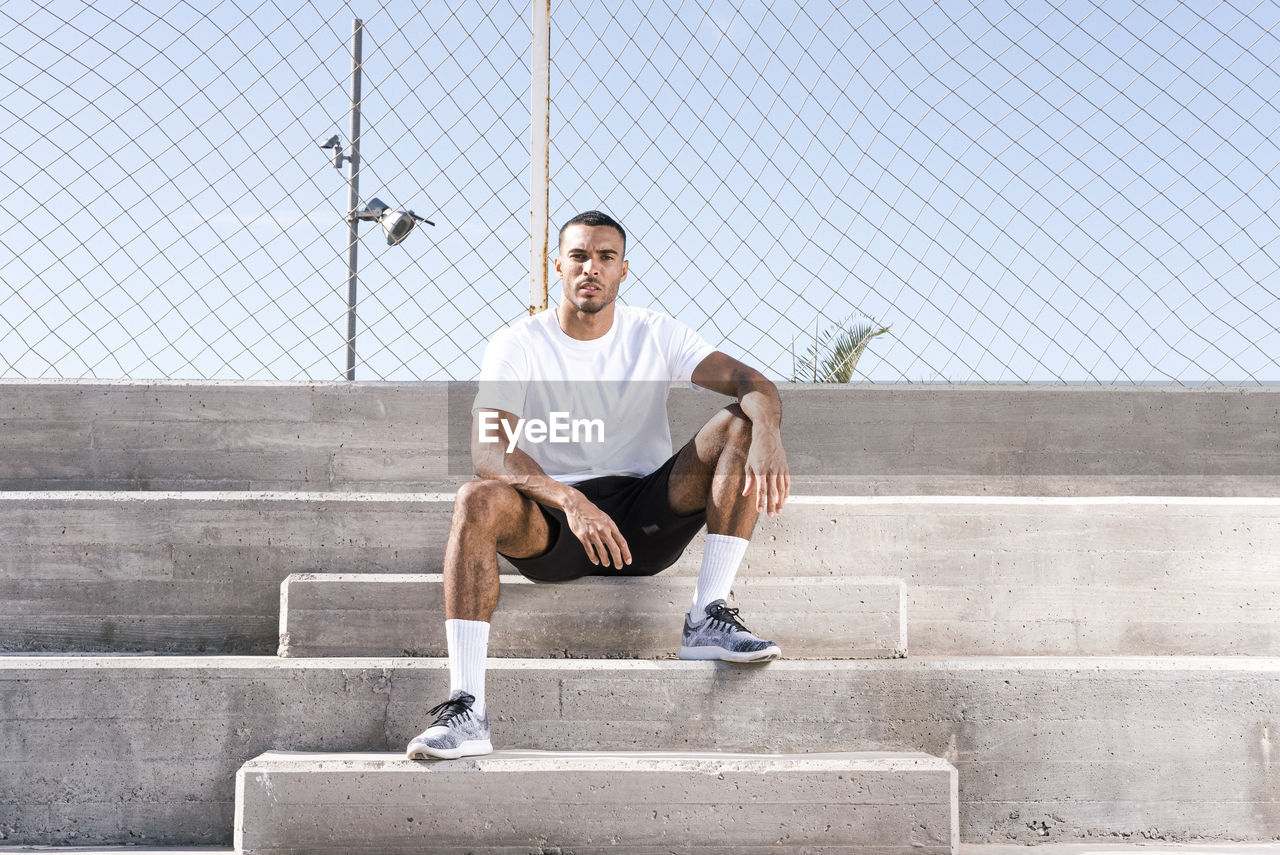 Full length african american male athlete portrait outdoors