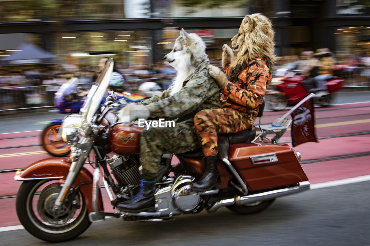 PEOPLE RIDING BICYCLES ON STREET