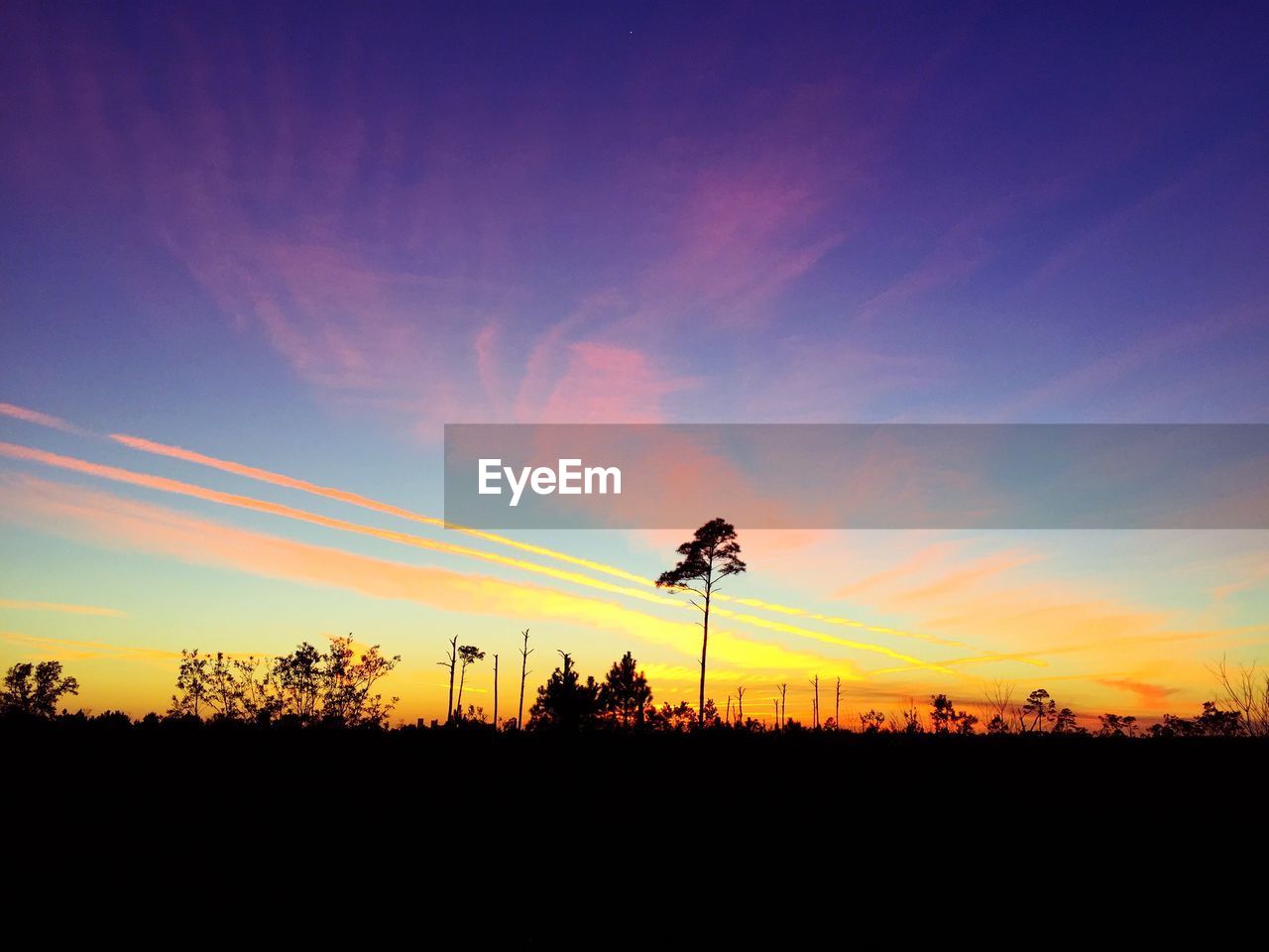 SILHOUETTE LANDSCAPE AGAINST BLUE SKY DURING SUNSET