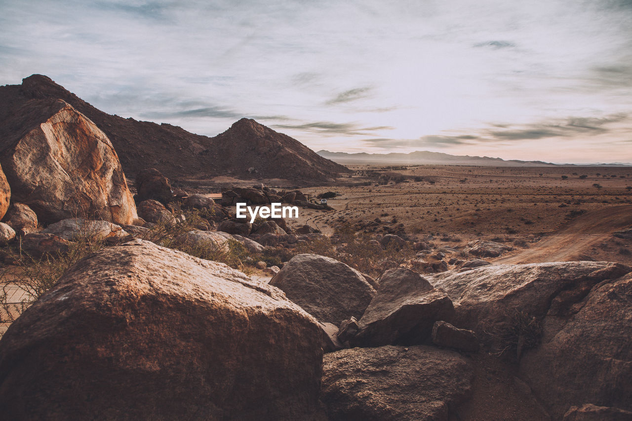 SCENIC VIEW OF ROCKS AGAINST SKY