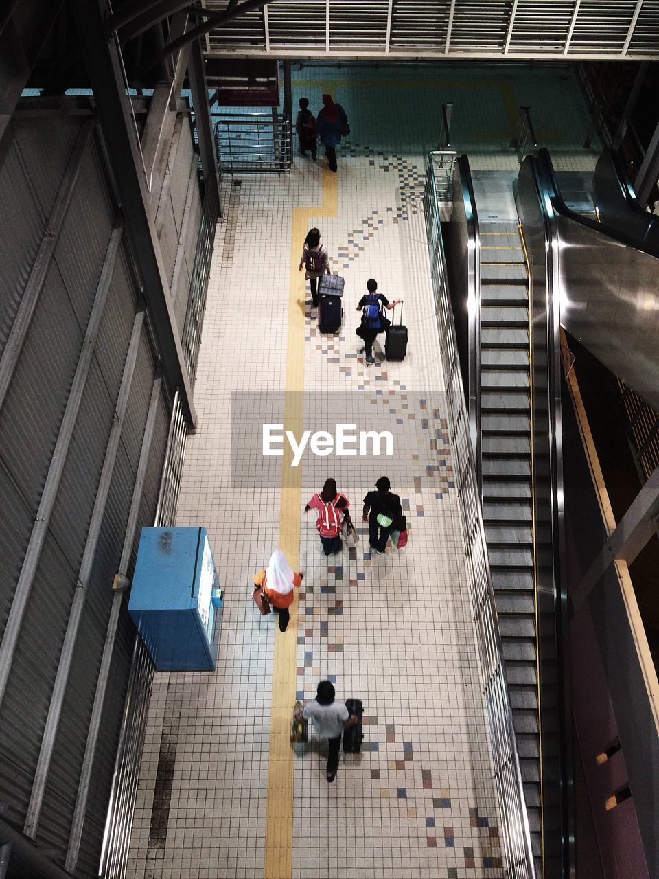 High angle view of people walking in building