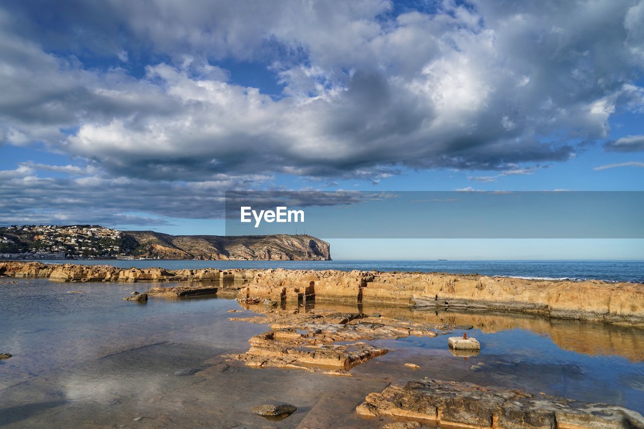 Scenic view of beach against sky