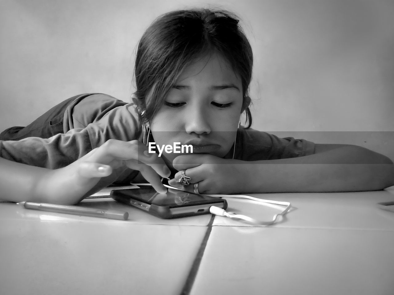 Portrait of boy with girl on table