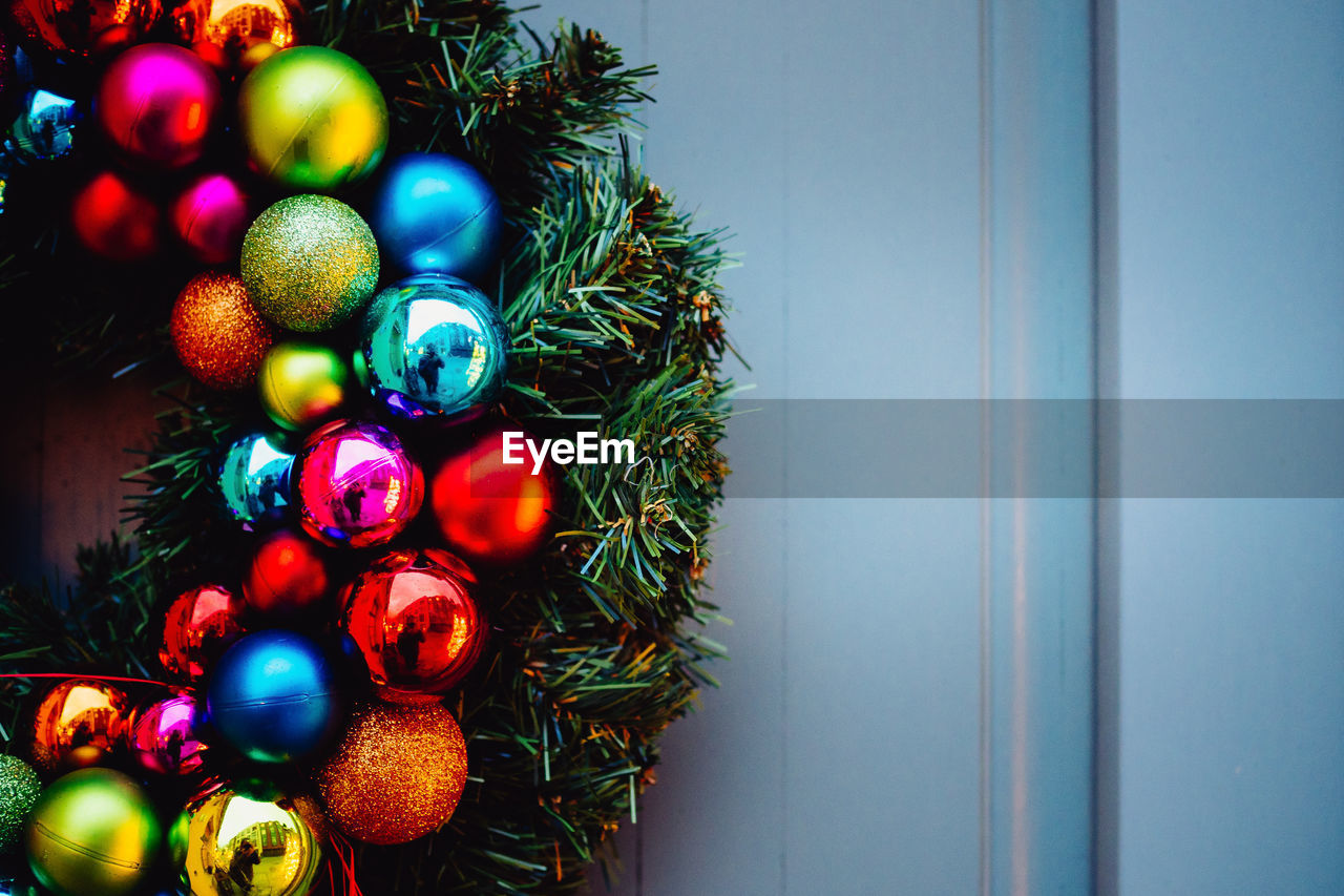Close-up of christmas wreath on door