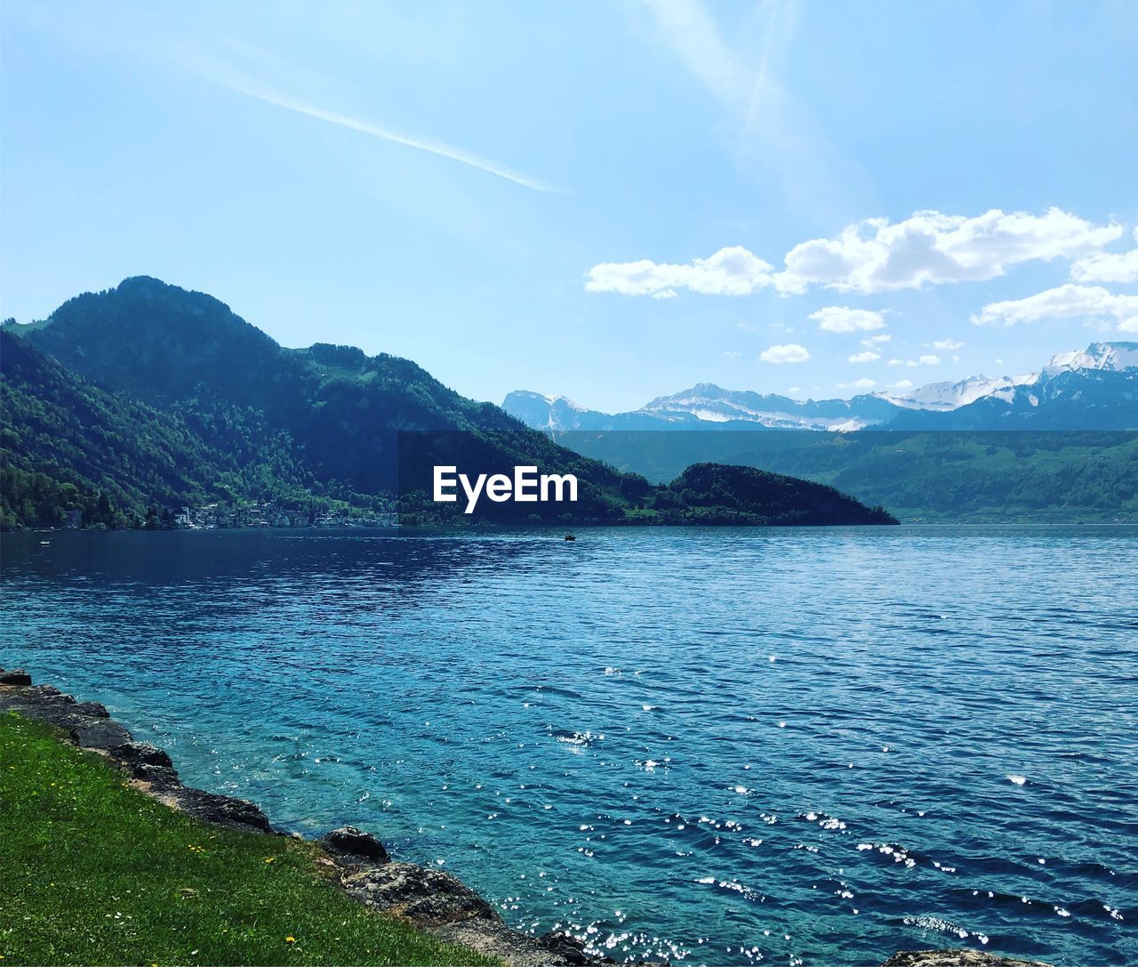 Scenic view of sea against blue sky