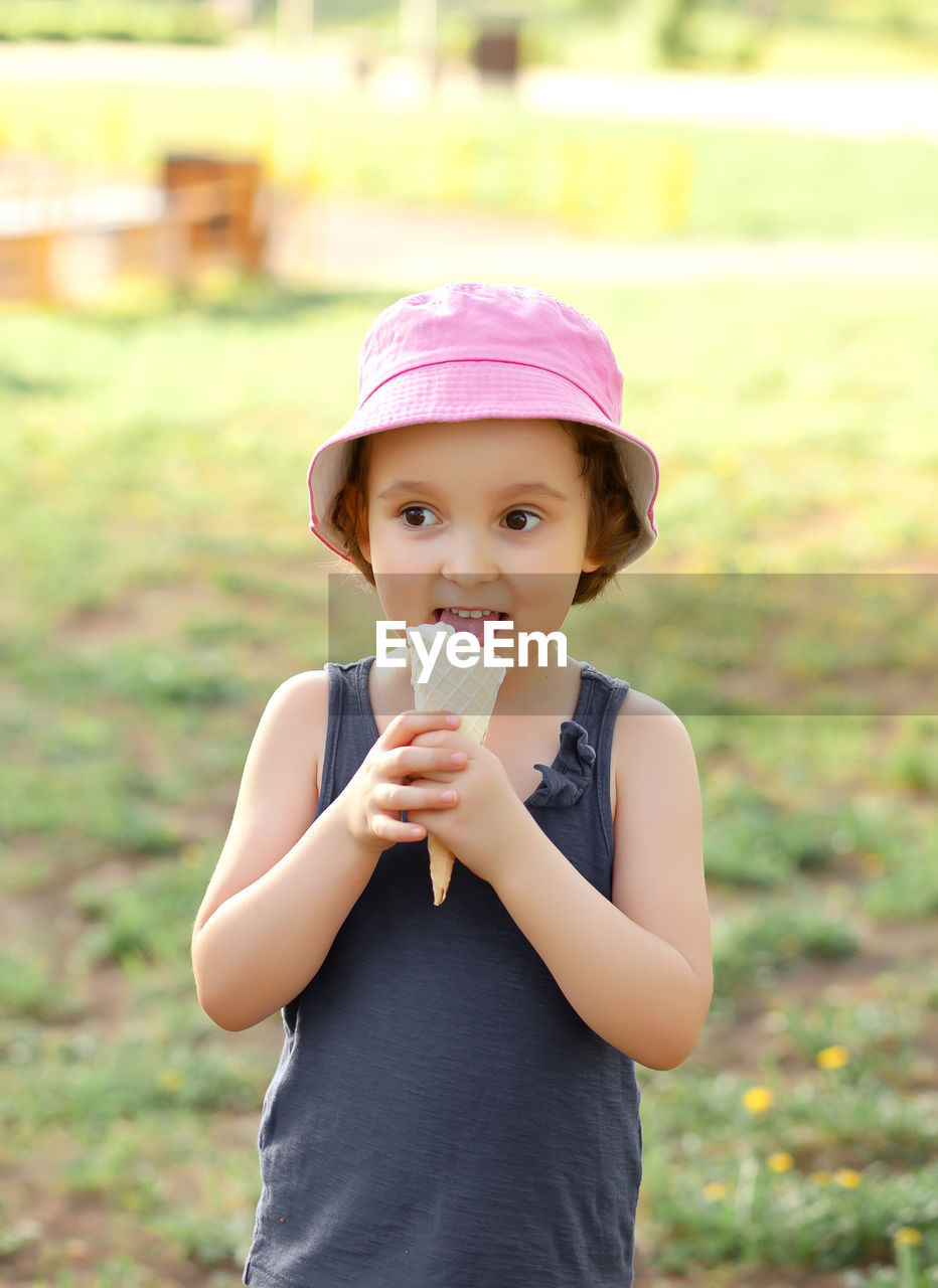 Portrait of girl holding ice cream