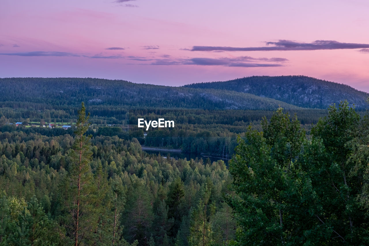 Scenic view of landscape against sky during sunset