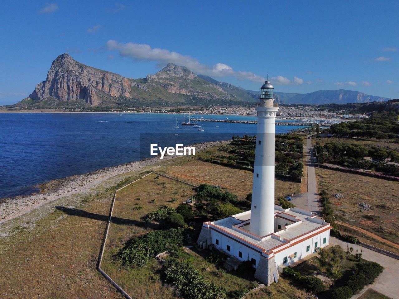 Scenic view of sea against clear sky lighthouse 