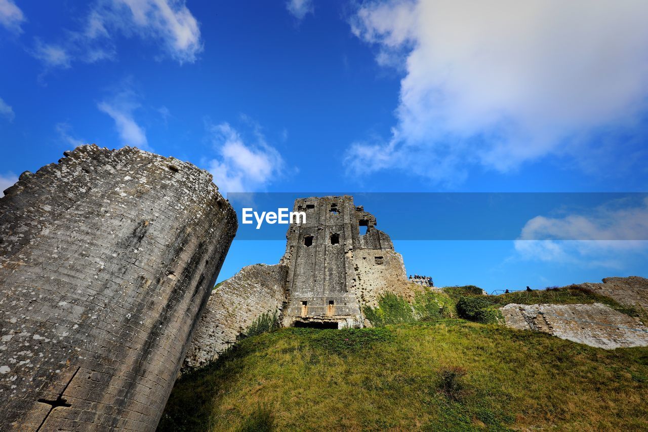 LOW ANGLE VIEW OF FORT AGAINST BLUE SKY