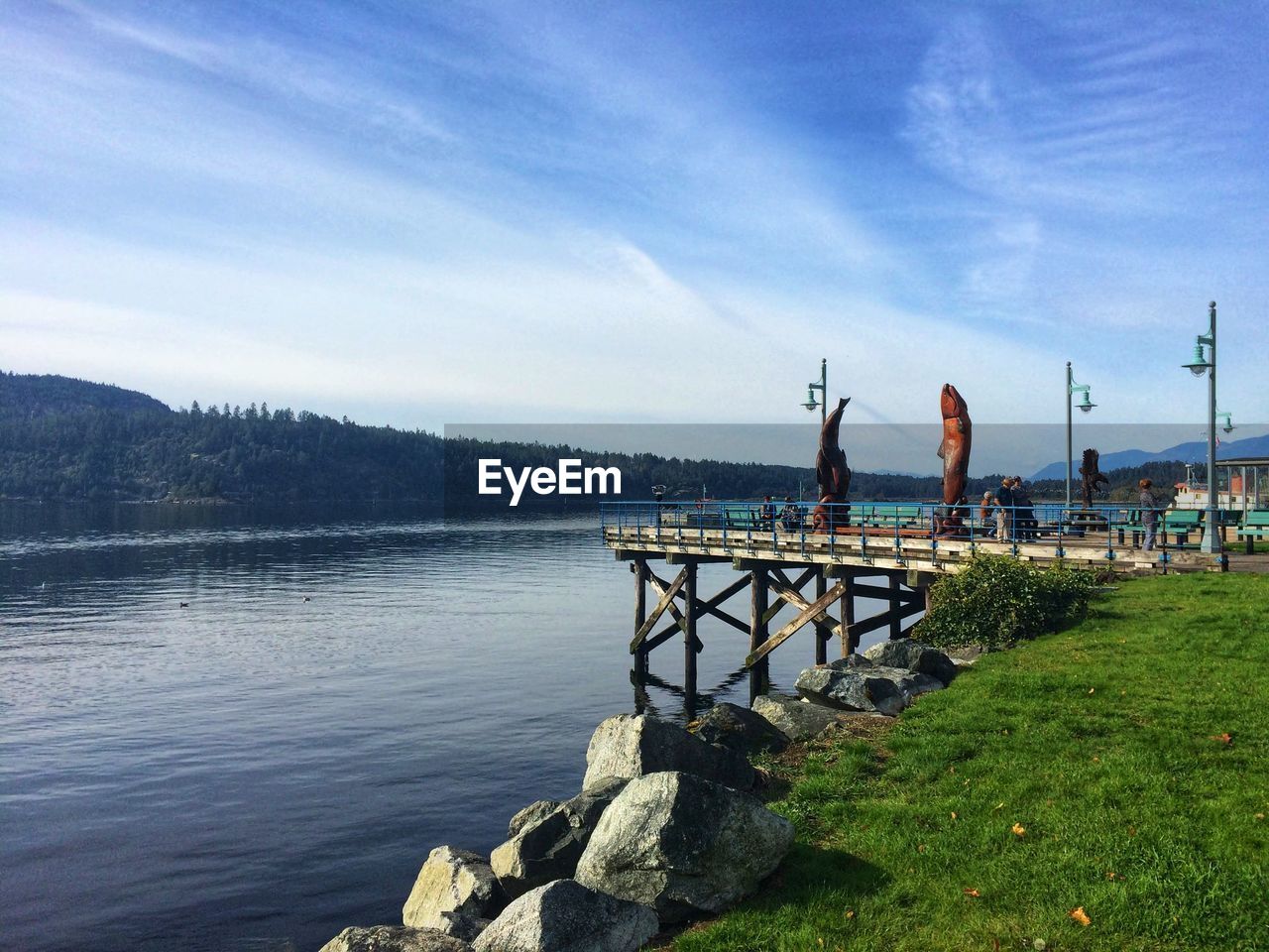 PIER ON LAKE AGAINST SKY