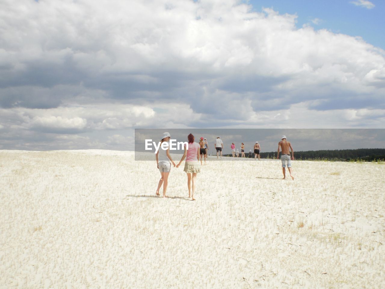 VIEW OF BEACH AGAINST CLOUDY SKY