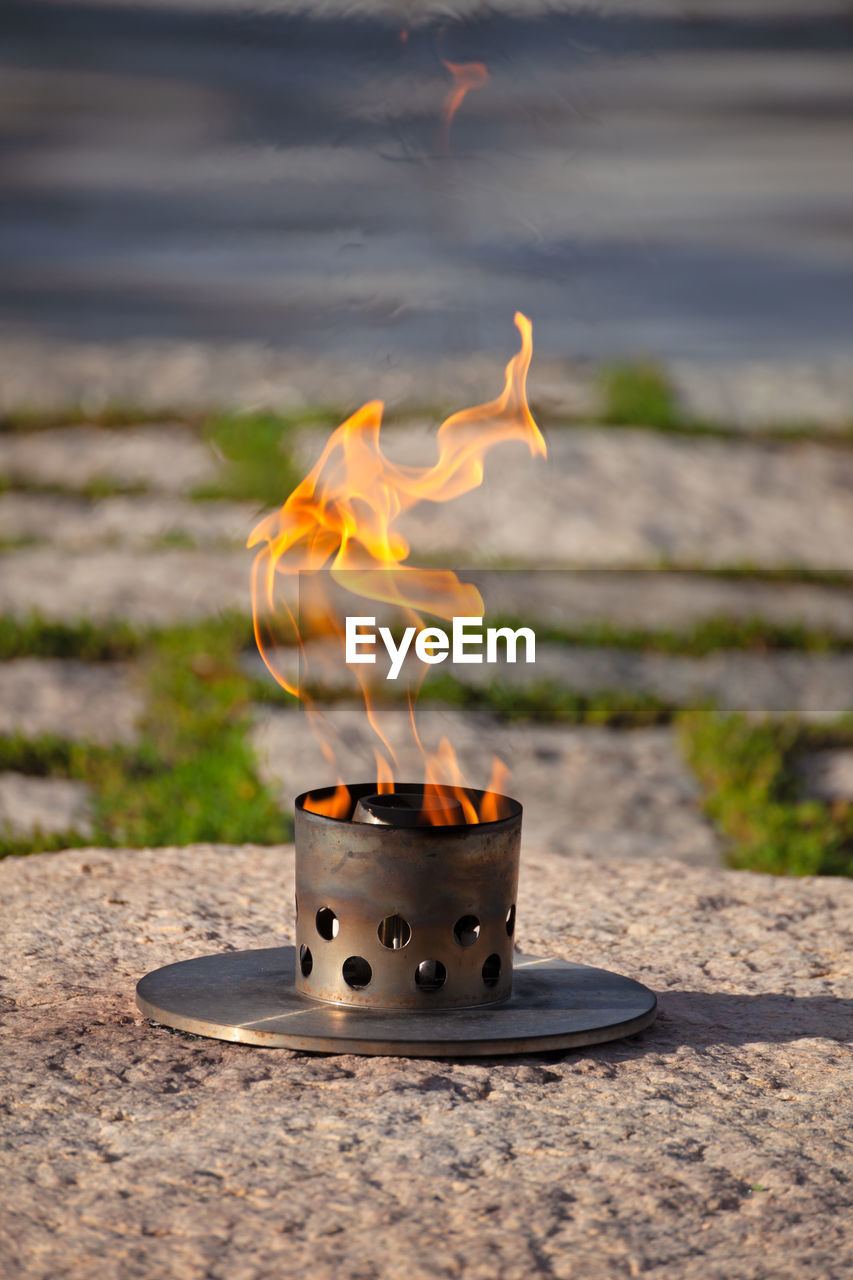 Eternal flame at president john f. kennedy's grave site at arlington national cemetery in virginia