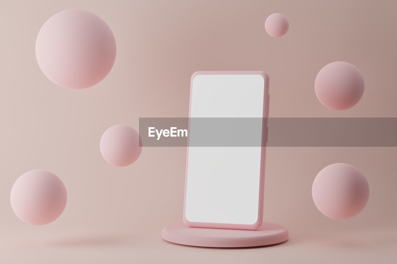 Modern smartphone on podium with flying bubbles on pink background, 3d render