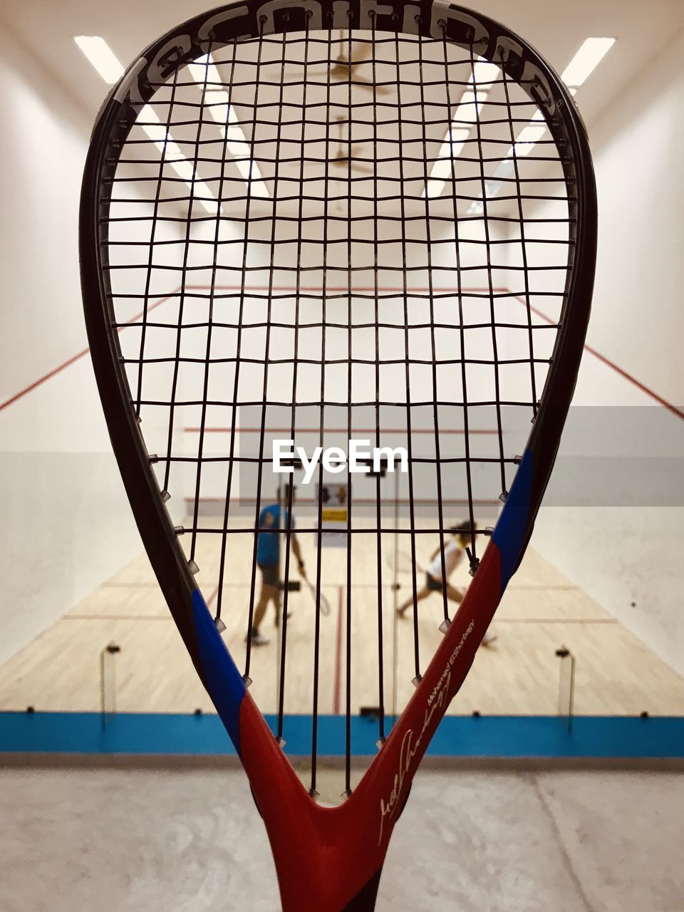 CLOSE-UP OF NET ON FLOOR AGAINST WHITE WALL