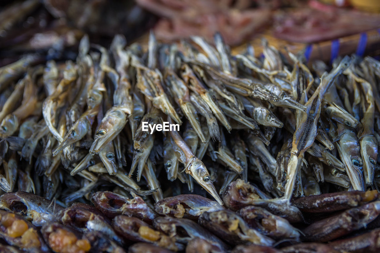 Close-up of dried fish for sale at market stall