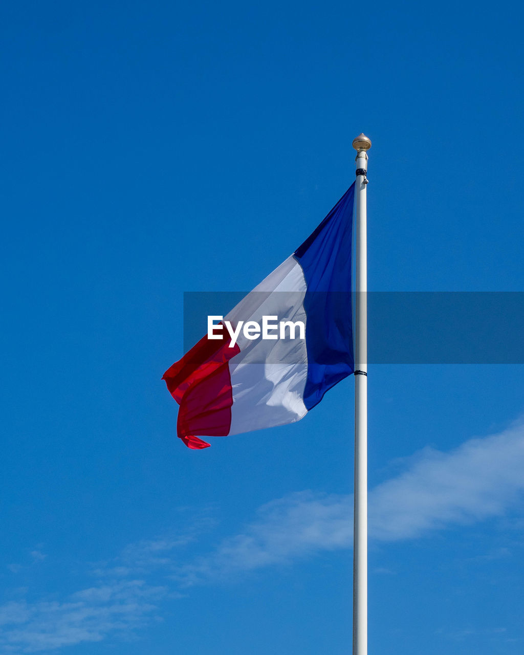 LOW ANGLE VIEW OF FLAG AGAINST SKY