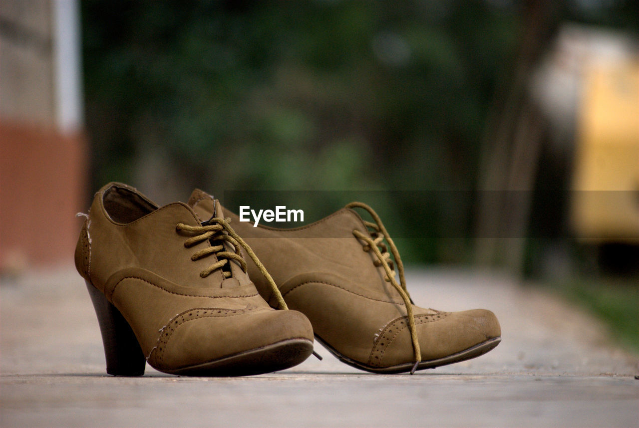 Close-up of shoes on ground