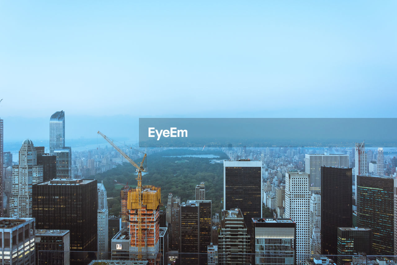 MODERN BUILDINGS AGAINST CLEAR SKY IN CITY