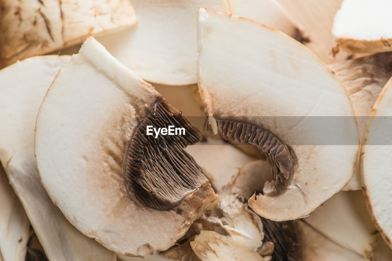 Close-up of sliced mushrooms, ingredients for pizza and roast.