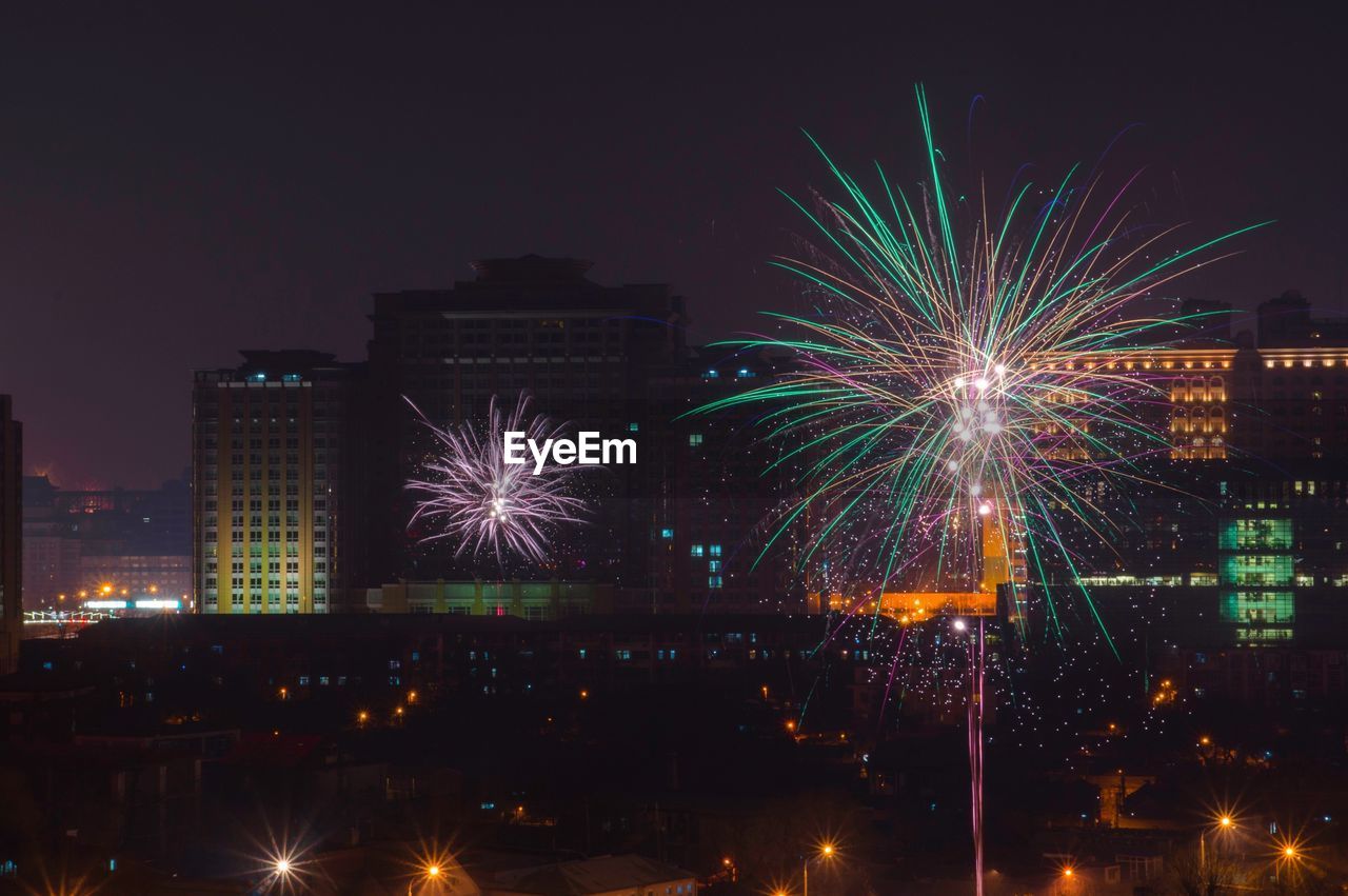 New year fireworks with buildings in background