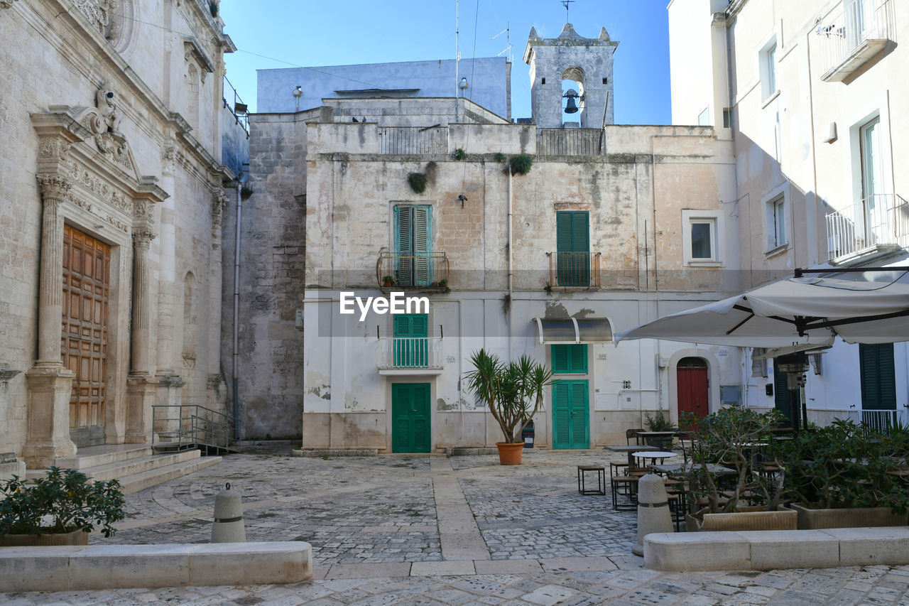 A square in the historic center of monopoli, a town in the puglia region, italy.