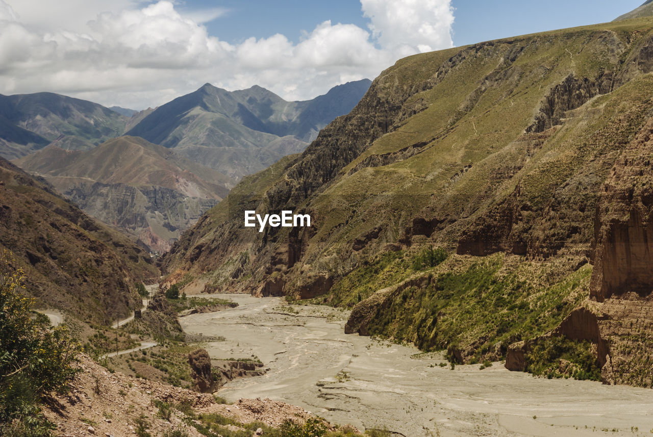 Scenic view of river amidst rocky mountains