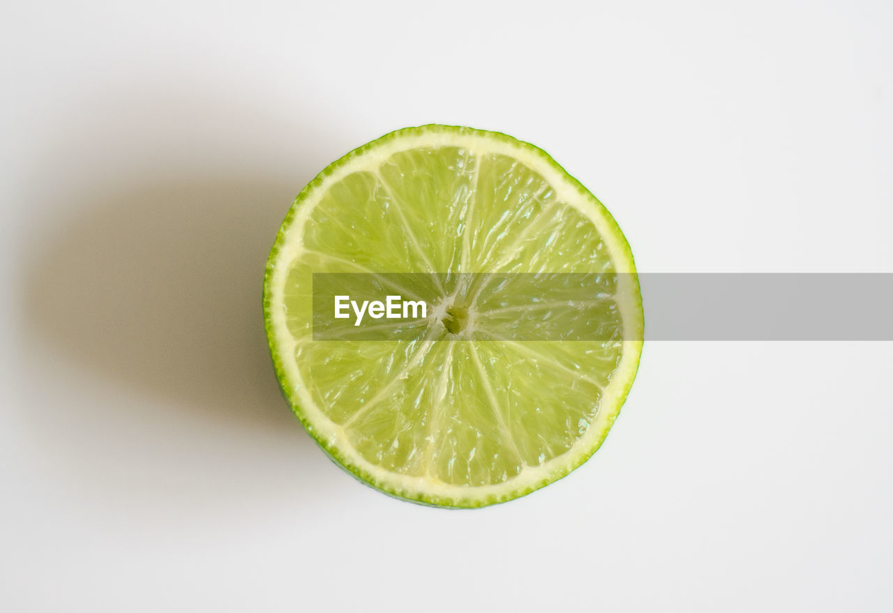 Close-up of lemon slice against white background