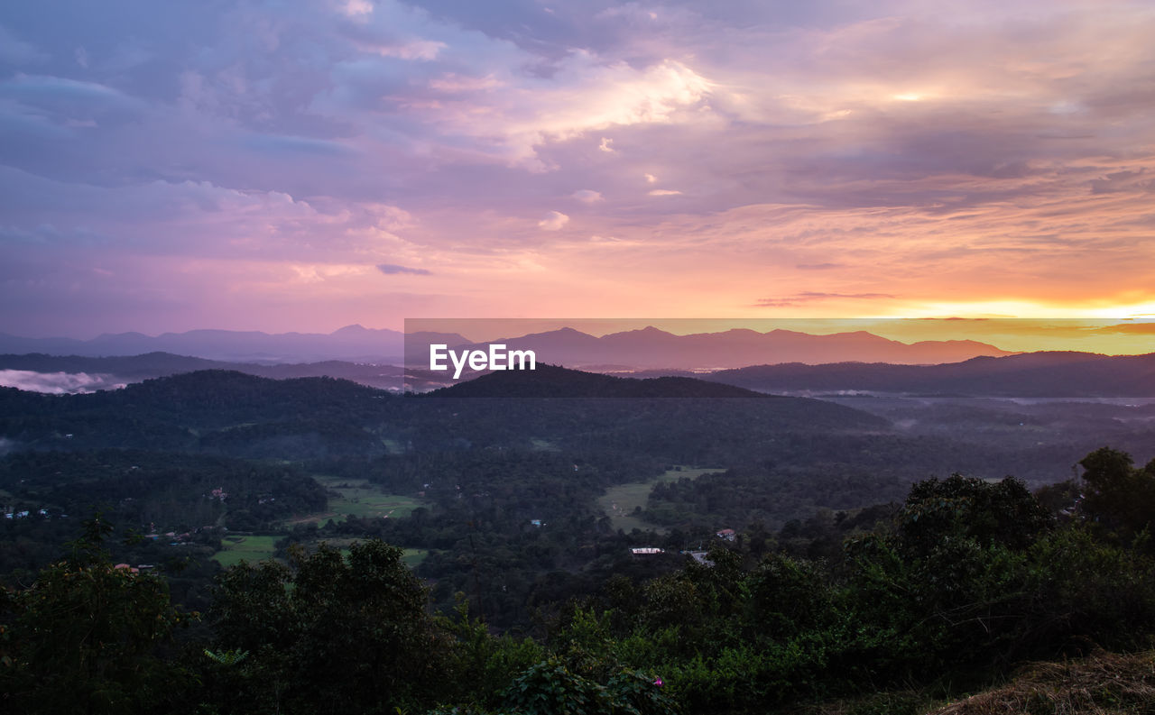 SCENIC VIEW OF LANDSCAPE AGAINST SKY DURING SUNSET