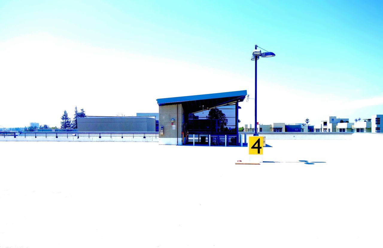 VIEW OF BUILT STRUCTURES AGAINST BLUE SKY