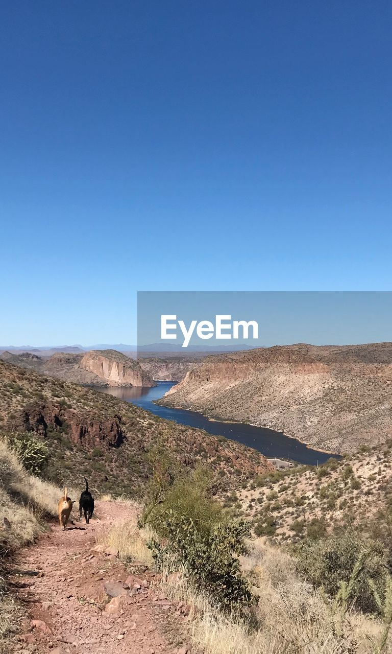 VIEW OF DESERT AGAINST CLEAR BLUE SKY