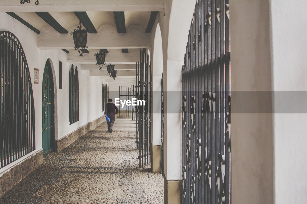 Man in corridor of building