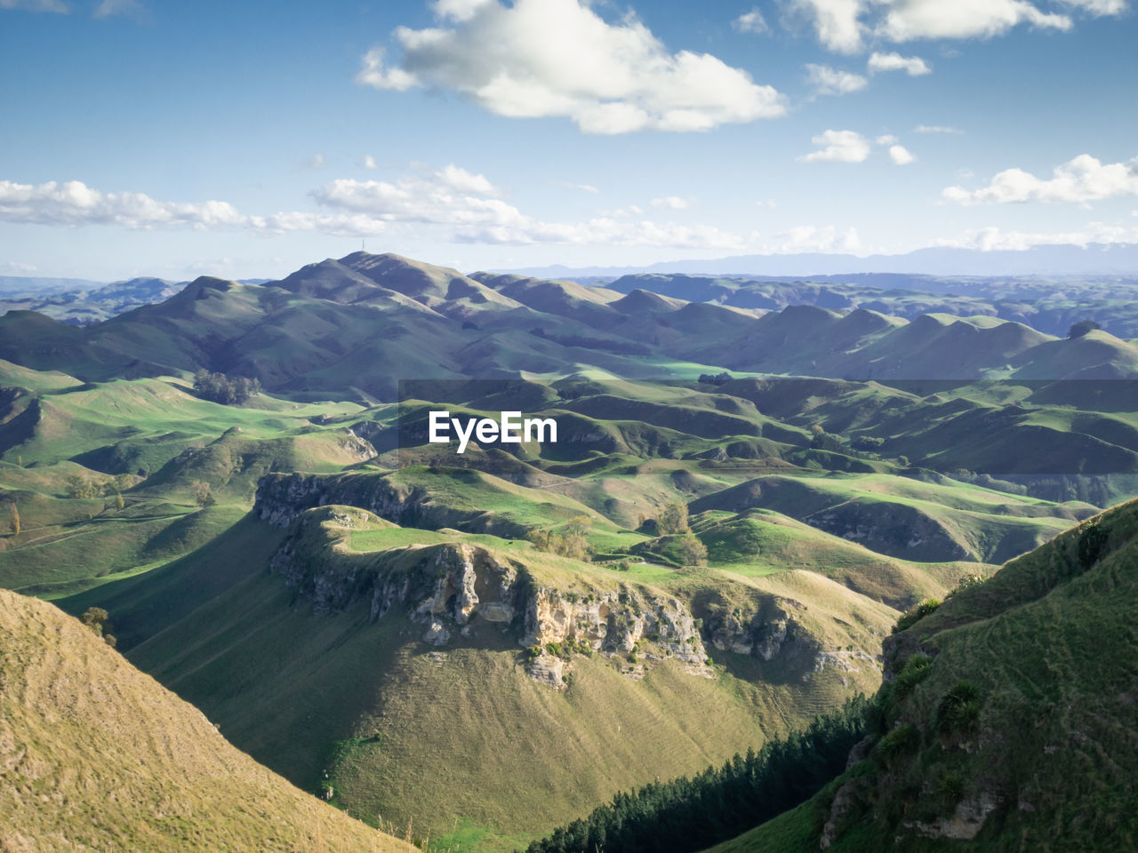 Rolling green hills and blue sky panorama,te mata peak, hawkes bay north island, new zealand