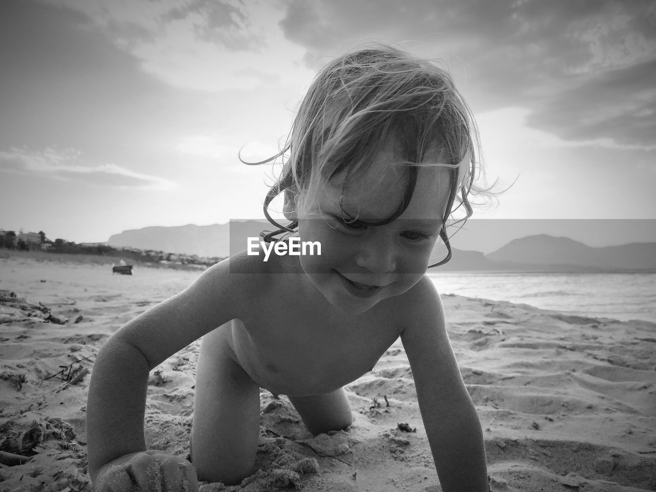 Happy kid playing on the beach 